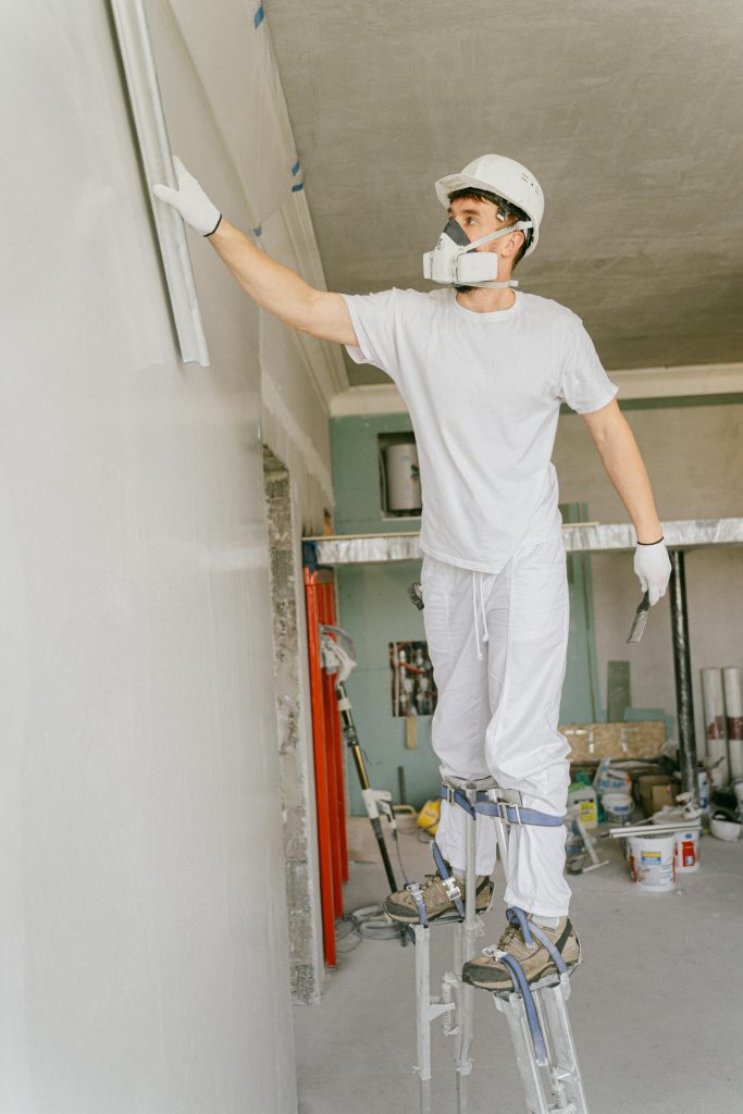 pexels-photo-5493651-5493651 A Man Wearing White Hard Hat Renovating a House